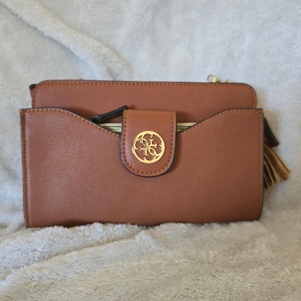 Guess brown faux leather crossbody with gold wallet pouch and gold decal.